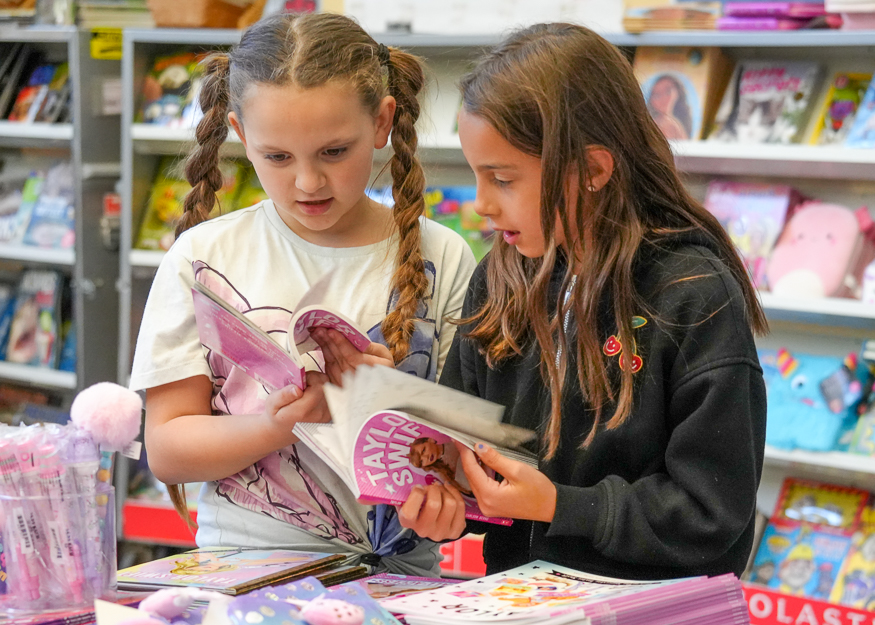 Students look at books