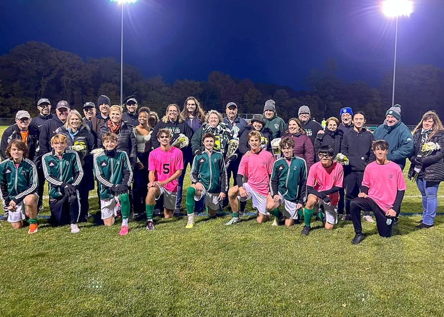 Group photo of soccer seniors and families