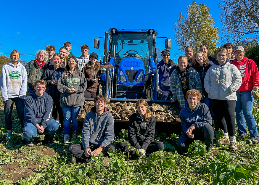 Group photo of students with tractor