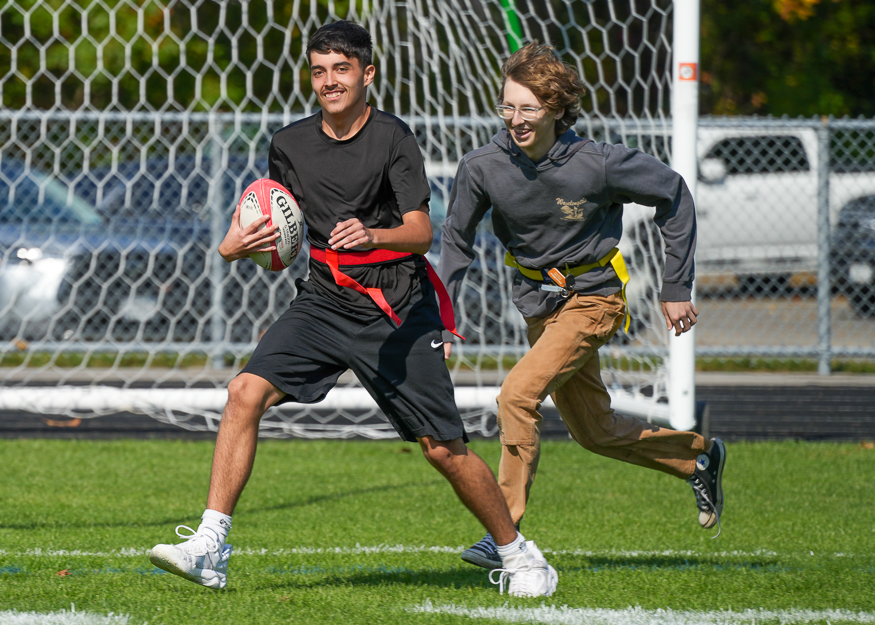 Students have fun playing rugby