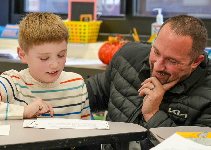 Father with son in class