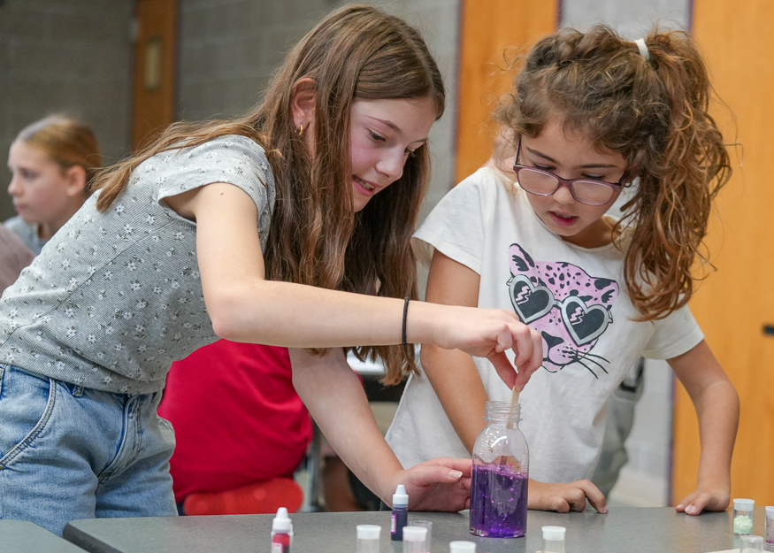 Students work together on craft