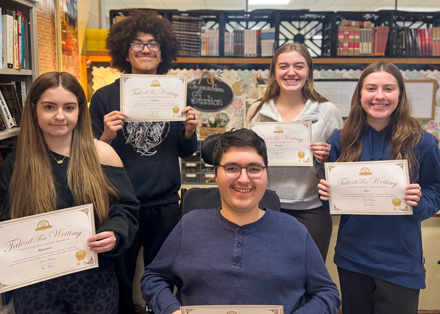 Group photo of students with certificates