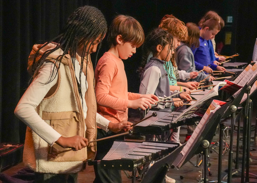 Students rehearse on instruments