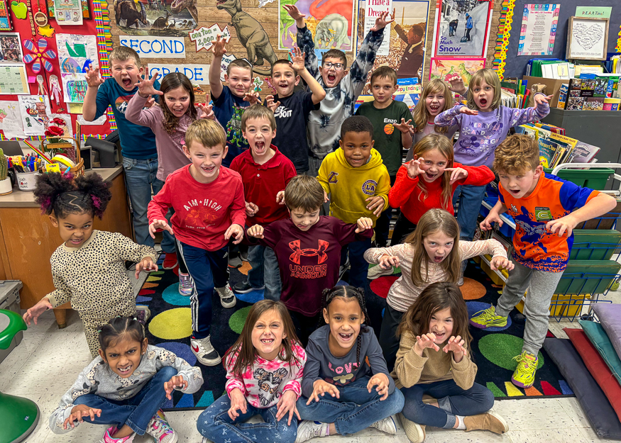 Group photo of students making scary faces