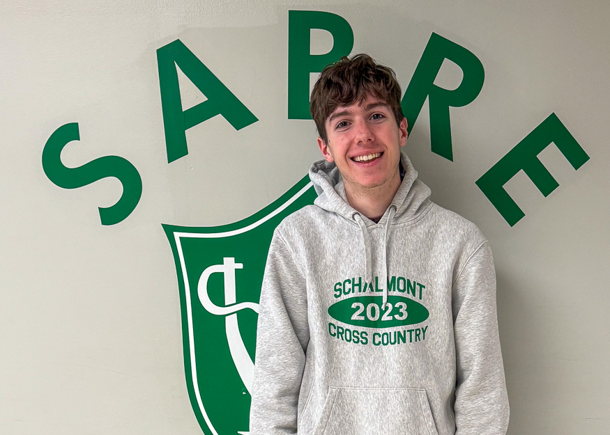 Student in front of Sabre sign