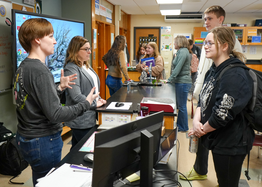 Speaker talks to student