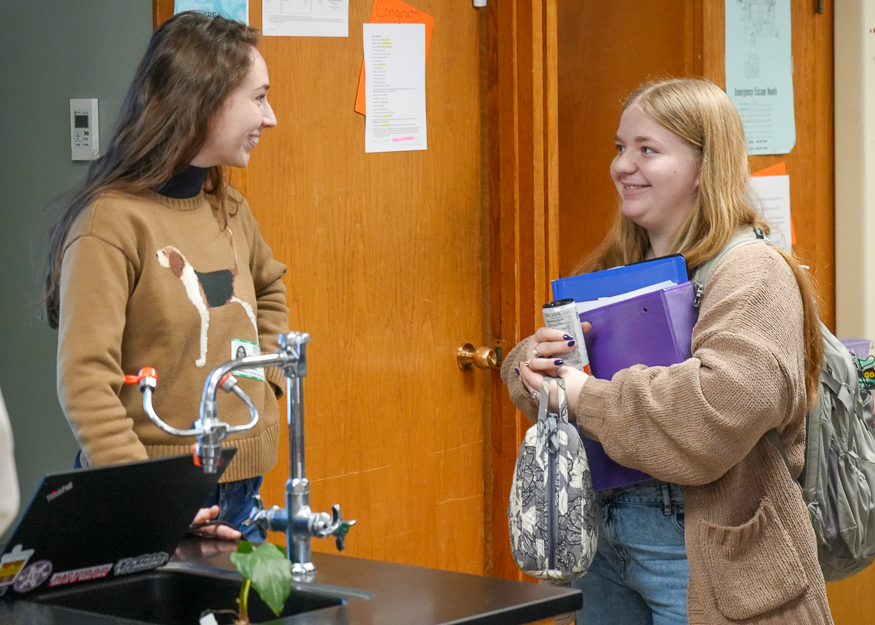 Speaker talks to student