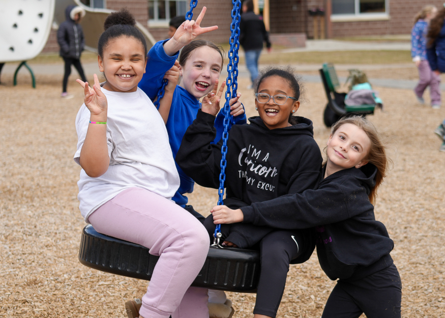 Girls on swing