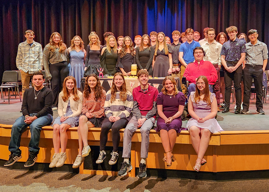 Group photo of students on stage